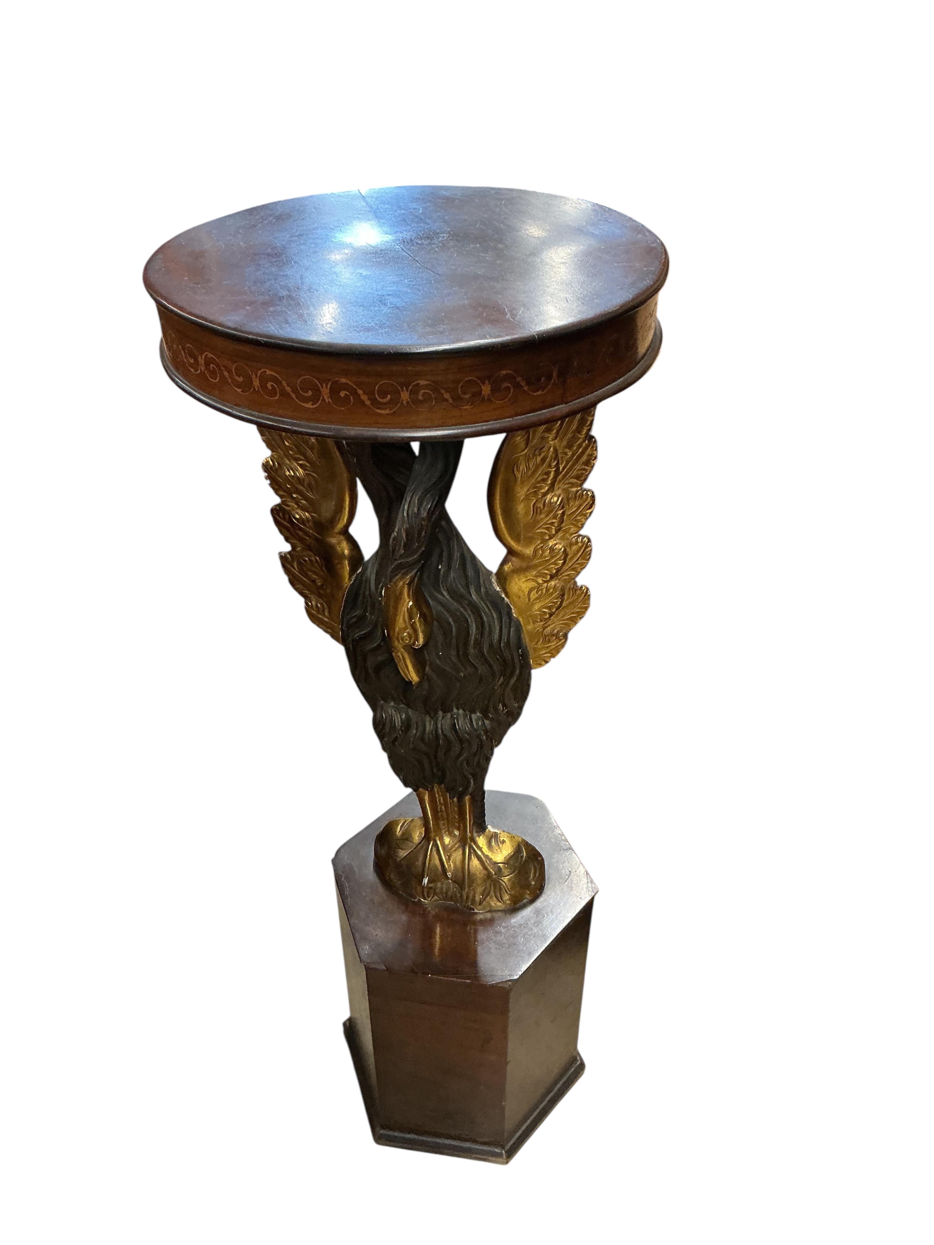 An Empire style carved wood phoenix occasional table on hexagonal plinth, height 99cm